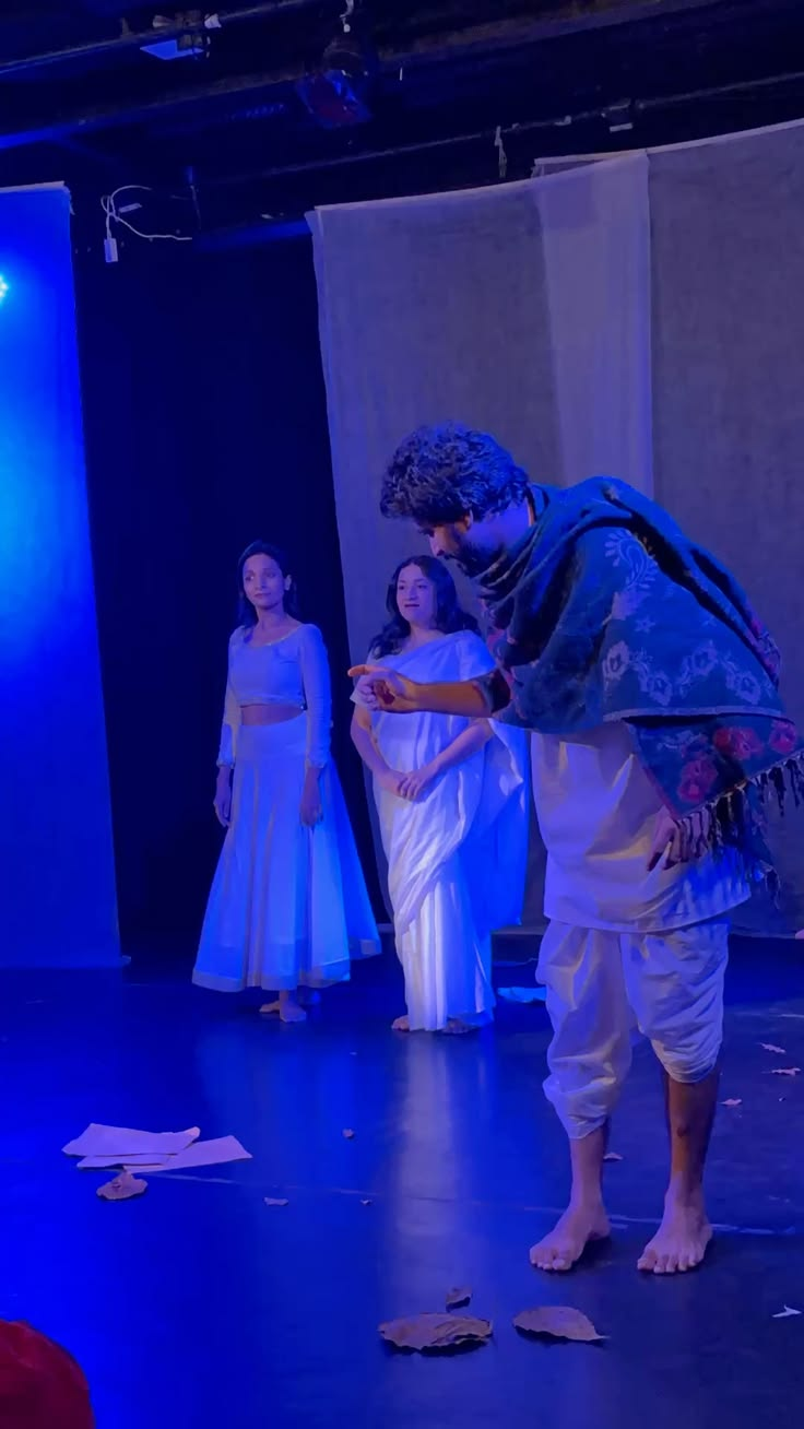 Intimate theatre rehearsal on a blue-lit stage — Dramawale contact